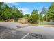 Community amenity featuring tennis courts, a pool, and a building at 8617 Canoe Ct, Raleigh, NC 27615