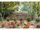 Stone entrance to the Durant Trails community featuring flowers and shrubbery at 8617 Canoe Ct, Raleigh, NC 27615