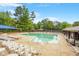 Community pool featuring plenty of seating and a large pool at 8617 Canoe Ct, Raleigh, NC 27615