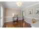 Formal dining room featuring hardwood floors, crown molding, and neutral paint palette at 8617 Canoe Ct, Raleigh, NC 27615