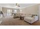 Comfortable living room with neutral-toned furnishings, carpeting, and ample natural light at 8617 Canoe Ct, Raleigh, NC 27615