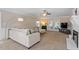 Spacious living room featuring plush carpeting, neutral tones, and access to the outdoor patio at 8617 Canoe Ct, Raleigh, NC 27615