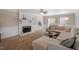 Cozy living room with a fireplace, plush seating, and plenty of natural light at 8617 Canoe Ct, Raleigh, NC 27615