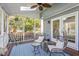 Screened porch with seating and ceiling fan at 8617 Canoe Ct, Raleigh, NC 27615