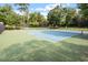 Community tennis courts surrounded by lush trees at 8617 Canoe Ct, Raleigh, NC 27615