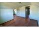 This is a picture of the attic bedroom with wood floors and 2 doors at 1006 Stallings Rd, Durham, NC 27703