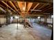 Unfinished basement, revealing the structural elements, concrete floor, and potential for customization at 1006 Stallings Rd, Durham, NC 27703