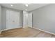 Spacious bedroom with hardwood floors, natural light, a closet, and an open doorway at 1013 Traders Trl, Wake Forest, NC 27587