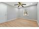 Bedroom featuring wood floors, ceiling fan, natural light from window, and closet space at 1013 Traders Trl, Wake Forest, NC 27587