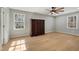 Bedroom with a ceiling fan, hardwood floors, and natural light at 1013 Traders Trl, Wake Forest, NC 27587