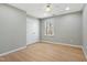 Cozy bedroom features wood floors, a ceiling fan, and a window, plus a closet at 1013 Traders Trl, Wake Forest, NC 27587