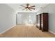 Open bedroom with hardwood floors, ceiling fan and natural light at 1013 Traders Trl, Wake Forest, NC 27587