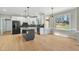 Open-concept kitchen featuring granite countertops, stainless steel appliances, and natural light at 1013 Traders Trl, Wake Forest, NC 27587
