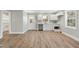 Bright kitchen featuring white cabinets, modern windows and beautiful flooring at 1013 Traders Trl, Wake Forest, NC 27587