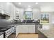 Kitchen with stainless appliances, granite counters, and ample natural light at 1013 Traders Trl, Wake Forest, NC 27587