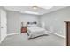 Bright bedroom featuring skylights, neutral decor, and comfortable carpeting at 10510 Sablewood Dr # 108, Raleigh, NC 27617