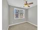 An empty bedroom with neutral walls and a ceiling fan above at 10510 Sablewood Dr # 108, Raleigh, NC 27617