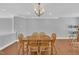 Open dining space with hardwood floors and modern lighting at 10510 Sablewood Dr # 108, Raleigh, NC 27617