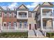 Attractive multi-level townhome with a front porch and a combination of siding and brick at 10510 Sablewood Dr # 108, Raleigh, NC 27617