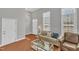 Cozy living room with large windows, hardwood floors, and neutral decor at 10510 Sablewood Dr # 108, Raleigh, NC 27617