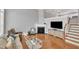 Comfortable living room with a fireplace, high ceilings, and hardwood floors at 10510 Sablewood Dr # 108, Raleigh, NC 27617