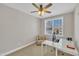 Bright office space with a ceiling fan, desk, chair, and natural light at 10510 Sablewood Dr # 108, Raleigh, NC 27617