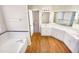 Large bathroom with double sinks, cabinets and a seperate tub space at 110 Chickasaw Cir, Clayton, NC 27527