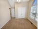 Neutral bedroom with carpeting, closet and vaulted ceiling window with natural light at 110 Chickasaw Cir, Clayton, NC 27527