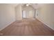 A bedroom shows neutral carpet, paint and vaulted ceilings, awaiting your decor at 110 Chickasaw Cir, Clayton, NC 27527