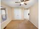 Comfortable carpeted bedroom with ceiling fan and double closet for ample storage at 110 Chickasaw Cir, Clayton, NC 27527