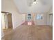 Spacious living room with carpet flooring and a vaulted ceiling, offering plenty of natural light at 110 Chickasaw Cir, Clayton, NC 27527