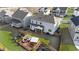 Aerial view showcases backyard with a patio, screened in porch, and wooden fence at 112 Ava Ct, Holly Springs, NC 27540