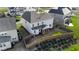 Aerial view of the back of the house features a screened porch and fenced yard at 112 Ava Ct, Holly Springs, NC 27540