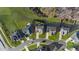 Overhead view of a neighborhood shows several homes, mature trees and landscaping at 112 Ava Ct, Holly Springs, NC 27540