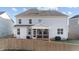 Well-maintained backyard features a screened porch and a privacy fence for outdoor enjoyment at 112 Ava Ct, Holly Springs, NC 27540