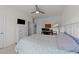 Comfortable bedroom features a dresser and built-in entertainment center with a large TV at 112 Ava Ct, Holly Springs, NC 27540