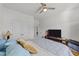 Inviting bedroom featuring a comfortable bed, a window, and double door closet at 112 Ava Ct, Holly Springs, NC 27540