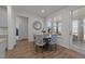 Cozy dining area with a round table, patterned chairs, and lots of natural light at 112 Ava Ct, Holly Springs, NC 27540