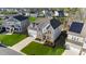 Stunning two-story home featuring a brick and stone facade, well-manicured lawn, and attached two-car garage in a desirable community at 112 Ava Ct, Holly Springs, NC 27540