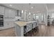 Kitchen with an island that offers seating and stainless steel appliances at 112 Ava Ct, Holly Springs, NC 27540