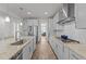 Bright kitchen with granite countertops, stainless steel appliances, and hardwood floors at 112 Ava Ct, Holly Springs, NC 27540