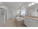 Luxurious main bathroom features a large soaking tub, tiled floor, double vanities and a glass shower at 112 Ava Ct, Holly Springs, NC 27540