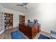 Spacious office area features hardwood floors, built in bookshelves and large wood desk at 112 Ava Ct, Holly Springs, NC 27540
