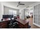 Bright home office with wood desk and view into a formal dining room, perfect for working from home at 112 Ava Ct, Holly Springs, NC 27540