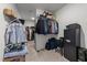 Organized walk-in closet featuring shelving and hanging storage for optimal space utilization at 112 Ava Ct, Holly Springs, NC 27540