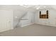Attic with built-in shelves, a skylight, ceiling fan and carpet at 113 Preston Pines Dr, Cary, NC 27513