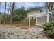 Tranquil backyard features stone patio, swing and manicured landscaping creates a private oasis at 113 Preston Pines Dr, Cary, NC 27513