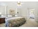 Comfortable bedroom featuring a large bed, soft carpet, and plenty of natural light at 113 Preston Pines Dr, Cary, NC 27513