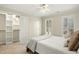 Bedroom featuring a ceiling fan, closet and bright windows at 113 Preston Pines Dr, Cary, NC 27513
