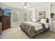Inviting bedroom featuring soft carpet, lots of natural light, and a comfortable bed at 113 Preston Pines Dr, Cary, NC 27513